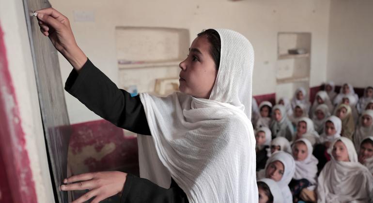 Afghan woman teaching in a classroom